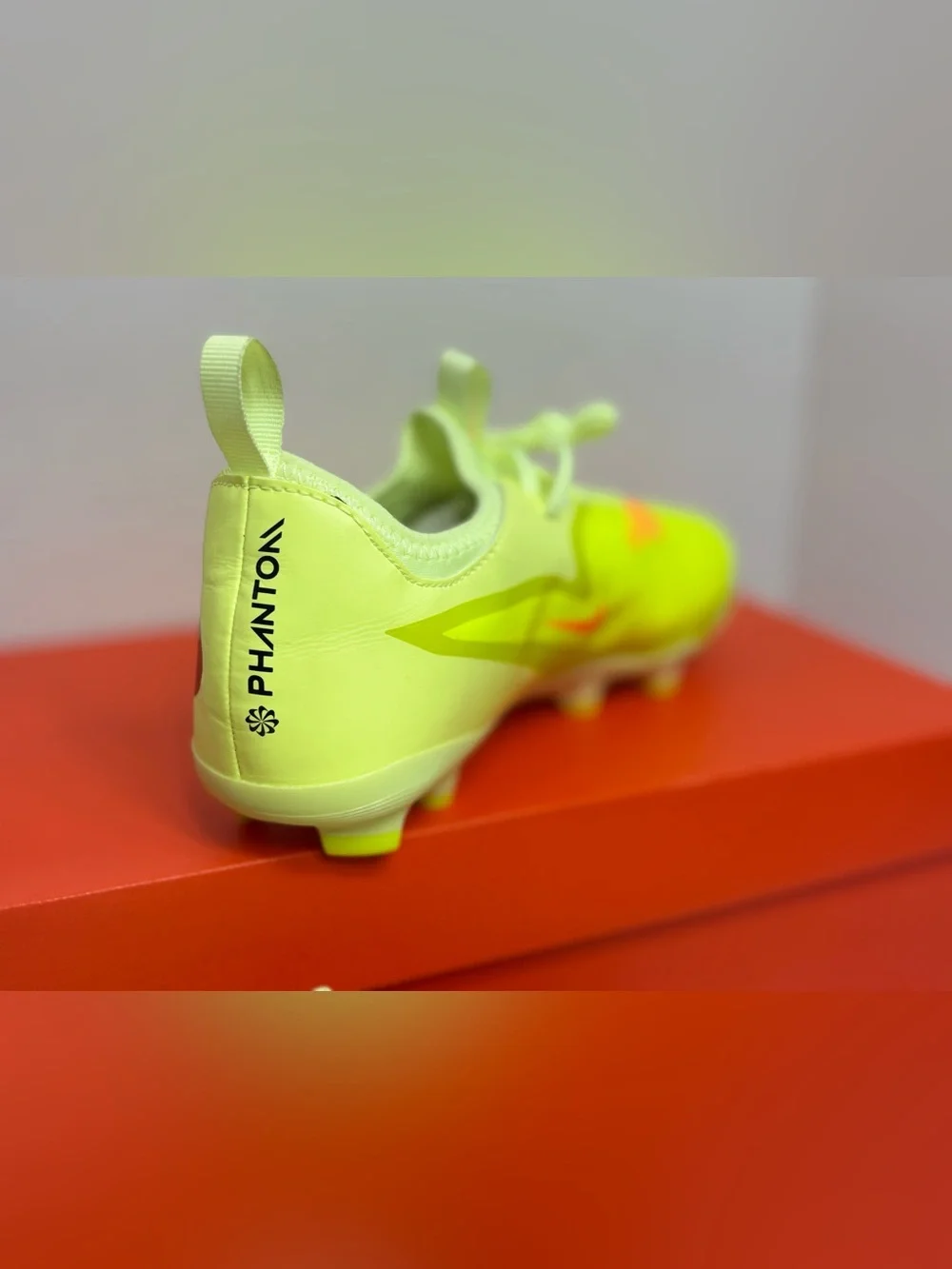 Nike Neon Yellow Soccer Cleats with Orange and Black Accents